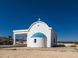 Title: Church of Saints Anargyroi in a Coastal Landscape