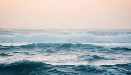 Fototapeta premium Ocean Waves Crashing Under a Soft Pink Sky