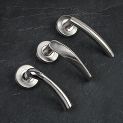 Modern Door Handles on Stone Background