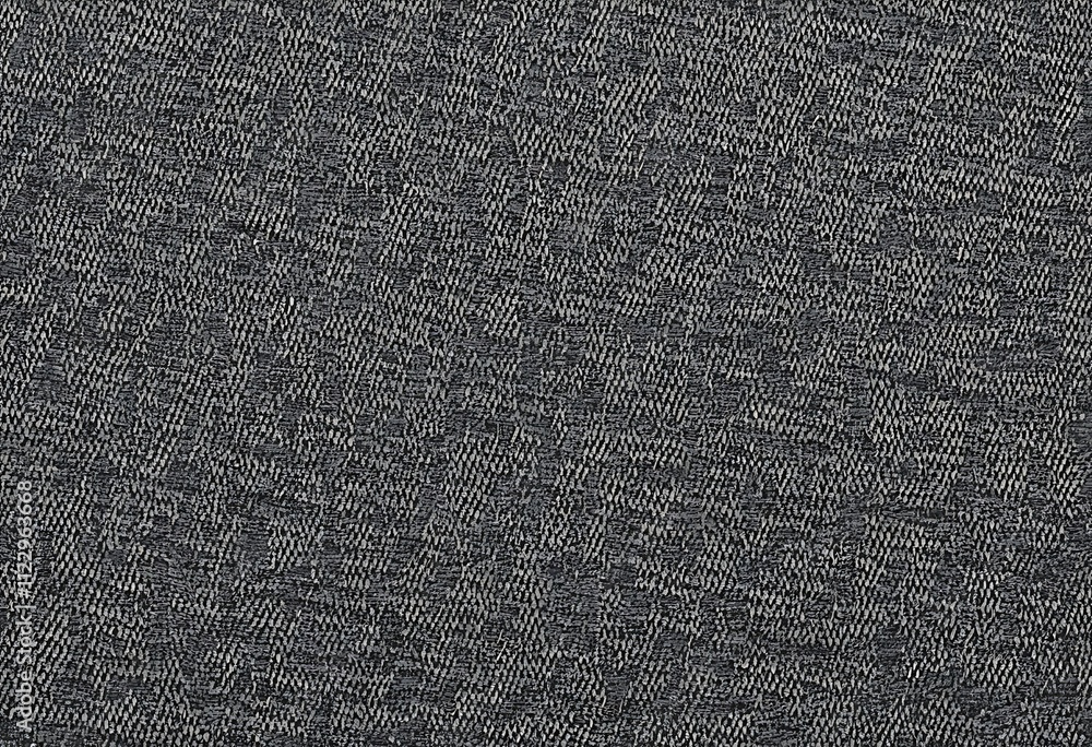 Poster closeup view of a dark gray fabric with a textured woven pattern. the material appears dense and sui