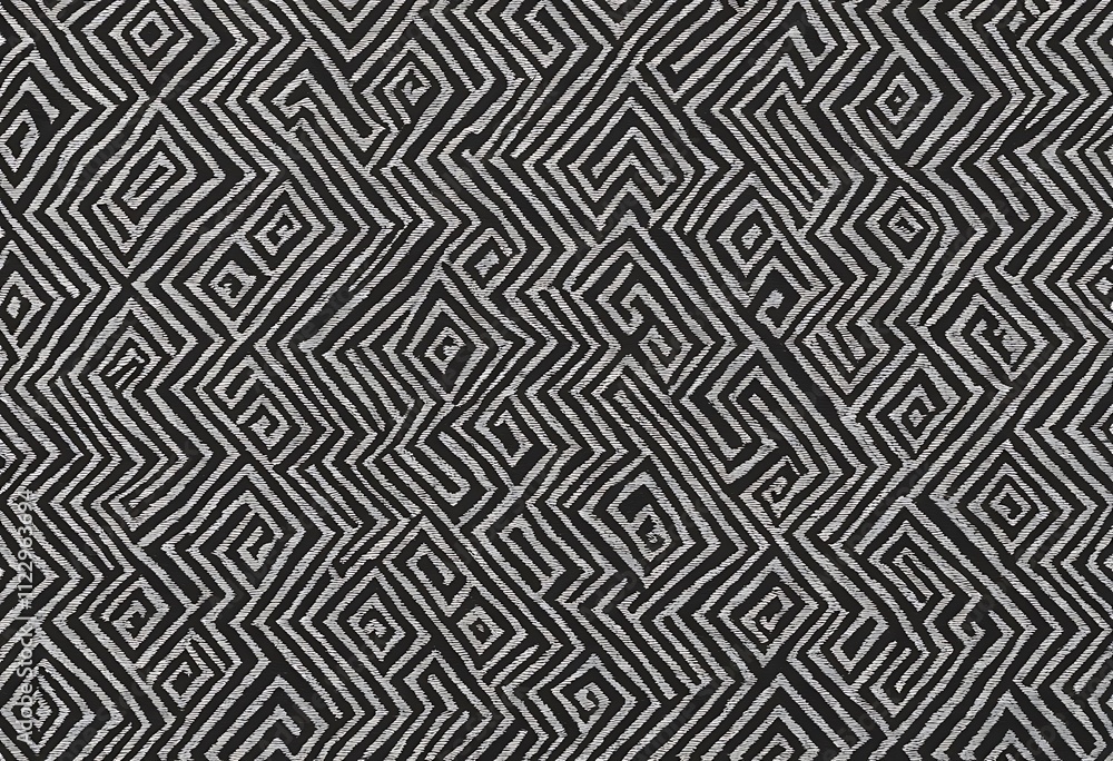 Aufkleber black and white textile featuring a repeating geometric pattern of interwoven zigzags spirals and di