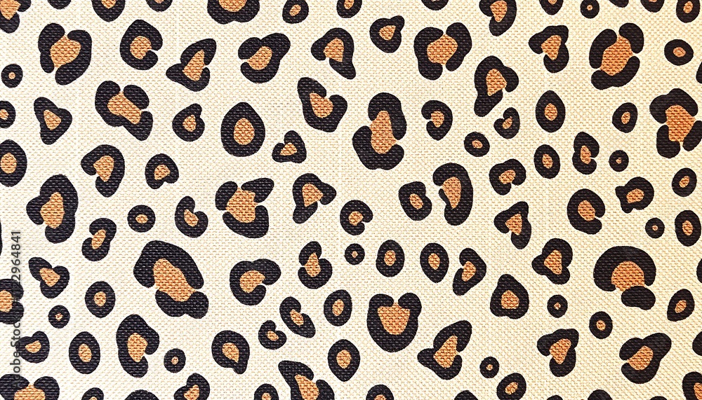 Poster closeup of a beige canvas texture featuring a repeating pattern of brown leopard spots. the spots va