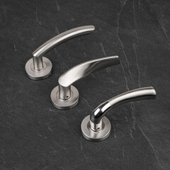 Modern Door Handles on Stone Background