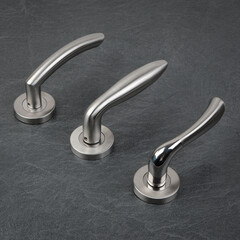 Modern Door Handles on Stone Background