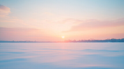 Fototapeta premium A peaceful winter sunrise over vast snow-covered fields, with pastel skies and a serene, tranquil winter landscape stretching to the horizon.