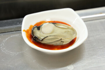 Korean seafood. Steamed Oysters with red chili pepper paste with vinegar