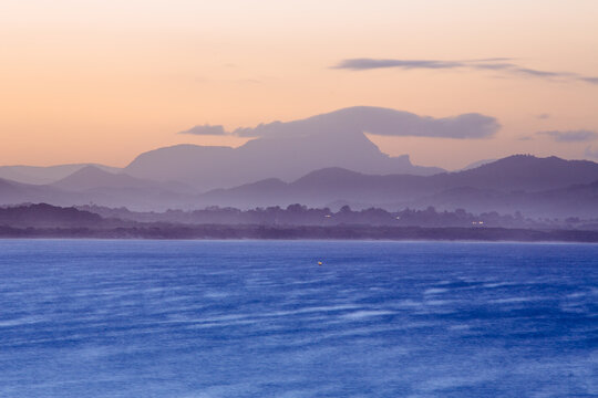 Sun setting over Mt Warning and Byron bay