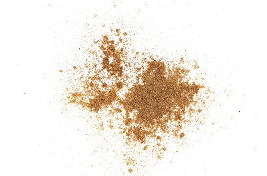 Ground cumin pile, minced caraway isolated on white, top view
