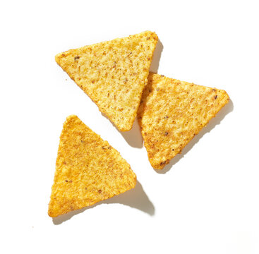 Golden nachos chips isolated on white background. top view