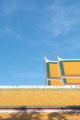 A minimalist-style image of a traditional Thai temple, showcasing clean architectural lines and a simple yet elegant design.