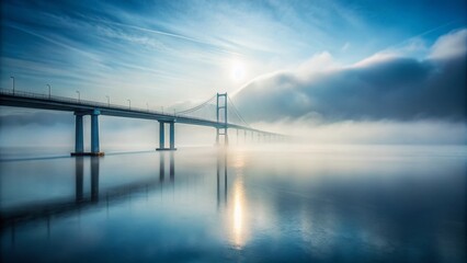 Fototapeta premium Serene Misty Ocean Bridge Enveloped in Fog: A Minimalist Perspective on Nature's Tranquility and Depth