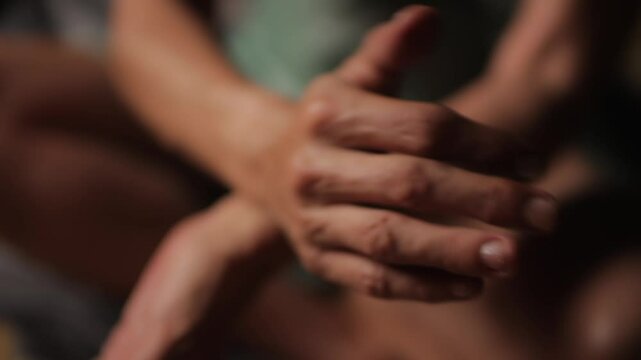 Tantra Massage Practice. Healer is lighting a palo santo stick from a candle on an altar.Element of Tantra Massage in Oriental Culture