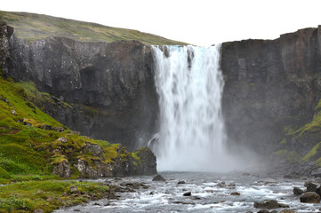 Beautiful waterfall over natural rocks