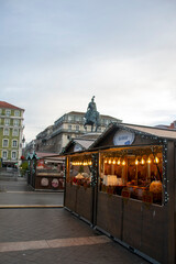 Christmas wooden kiosks illuminating figueira square in lisbon, portugal