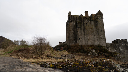 Fototapeta premium Eilean donan castle rising on a cloudy day in scotland