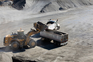Front end loader loading a truck in mine