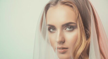 Caucasian female bride with veil and blonde hair gazing intently