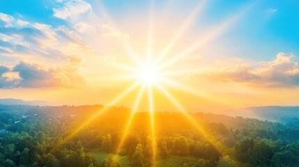 Fototapeta premium A vibrant sunrise casts golden rays over a lush green landscape, evoking a sense of peace and tranquility.