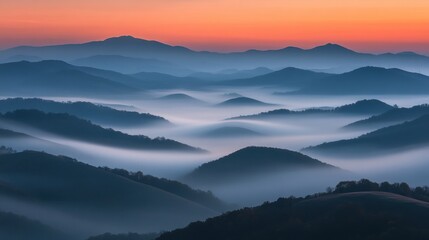Fototapeta premium A serene landscape at dawn, showcasing rolling hills shrouded in mist against a colorful sky.
