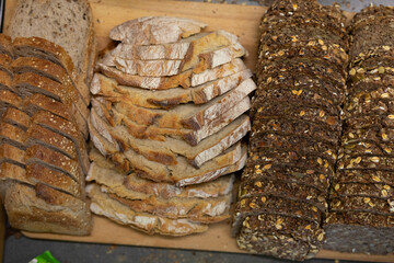 Assorted Artisan Bread Slices on Wooden Board
