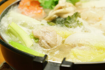 Vegetables, seafood, meat and mushrooms cooked in a pot, popular in winter in Japan and other Asian...