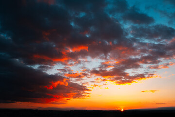 Fototapeta premium Colourful landscape of beautiful sunset or sunrise with cloudy sky. Natural abstract background.
