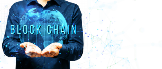 Businessman holding a glowing digital globe with BLOCKCHAIN text overlay, surrounded by network nodes and connections on a white background