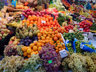 Various vegetables and fruits on the counter of the food market.