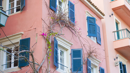 Beautiful facades of old European buildings along a cobbled street in Europe.