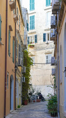 Beautiful facades of old European buildings along a cobbled street in Europe.