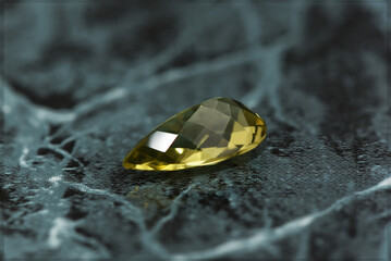 golden yellow citrine gemstone, on a black-white backgrond black-white marble