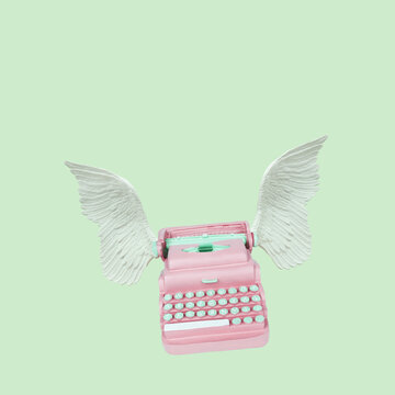Typewriter keys keytops old style with wings making creative lovely text. Creative literature poetry or nice words concept. Trendy pastel colors