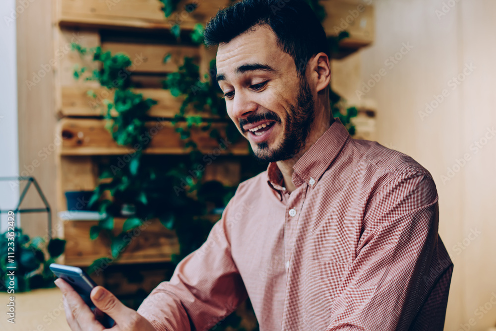Poster wondered bearded guy amazed with text message reading mail on smartphone, emotional hipster guy laug