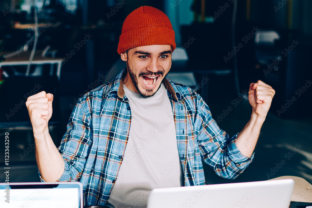 Poster back view of male employee working on laptop computer with mock up screen while emotional colleague 