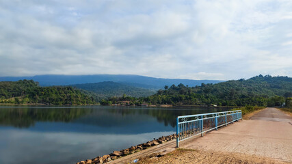 Road and lake with beautiful mountains nature landscape Nam Houm in Vientiane capital, Laos, Asia