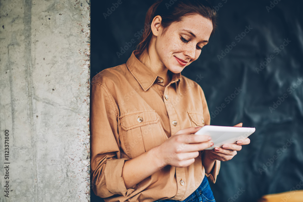 Poster positive female blogger watching interesting tutorial online on website via high speed internet conn
