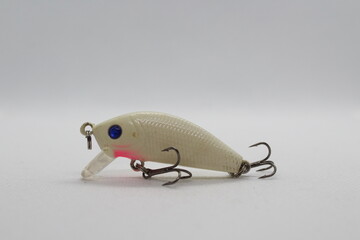 Small white wobbler crank bait for fishing isolated on a white background

