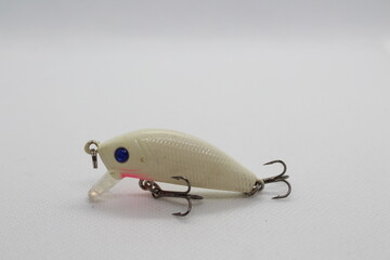 Small white wobbler crank bait for fishing isolated on a white background
