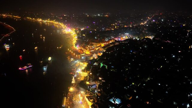 Drone view of Glowing Banaras City During Dev Diwali and Kashi Vishwanath Temple and Gyanvapi Mosque with Ghats