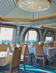 Formal and elegant ocean view Art Deco dining room restaurant onboard luxury cruiseship or cruise...