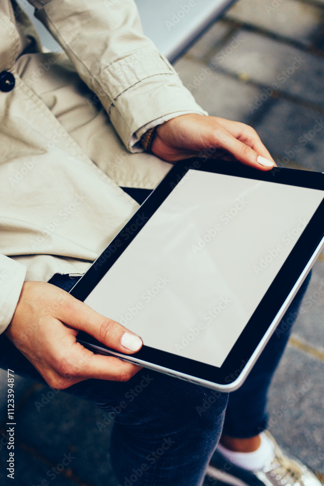 Poster cropped view of female hands holding digital touch pad device with copy space display for your websi