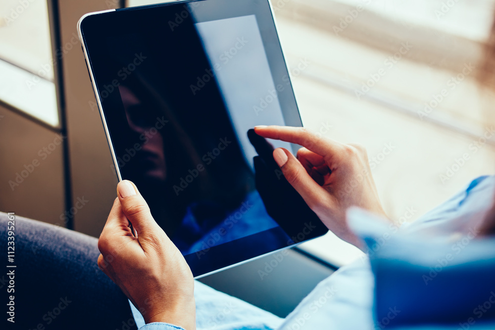 Aufkleber cropped view of hipster girl touching with finger on display of modern touch pad device sitting in t