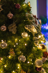 Close up Christmas tree with awesome toys in a cozy living room