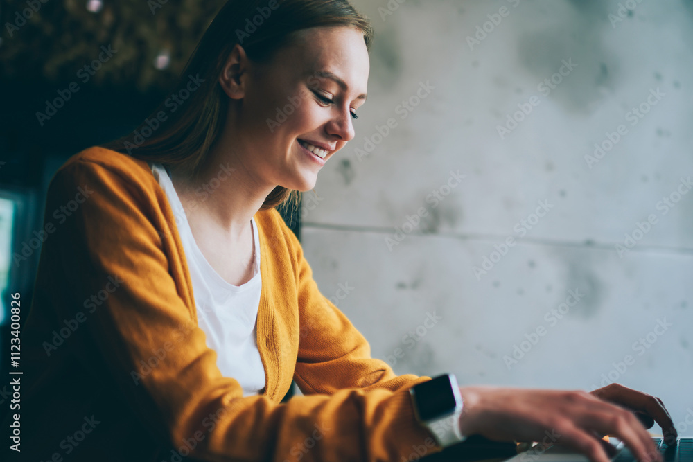 Aufkleber happy woman laughing from messaging with friend in social network browsing wireless internet on lapt