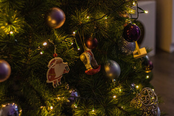 Close up Christmas tree with awesome toys in a cozy living room