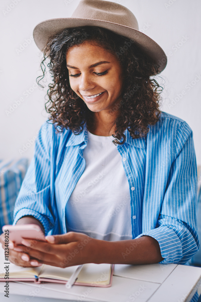Aufkleber smiling african female bogger installing application for creating new publication on content website