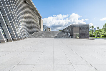 Fototapeta premium Empty brick floor and modern city buildings background