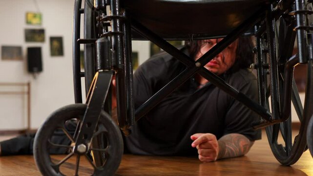 Video of paralyzed man touching and moving his wheelchair