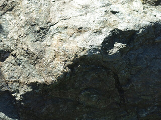 Obraz premium texture of a rough gray wild stone