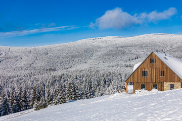 Small house in the snowy mountains
